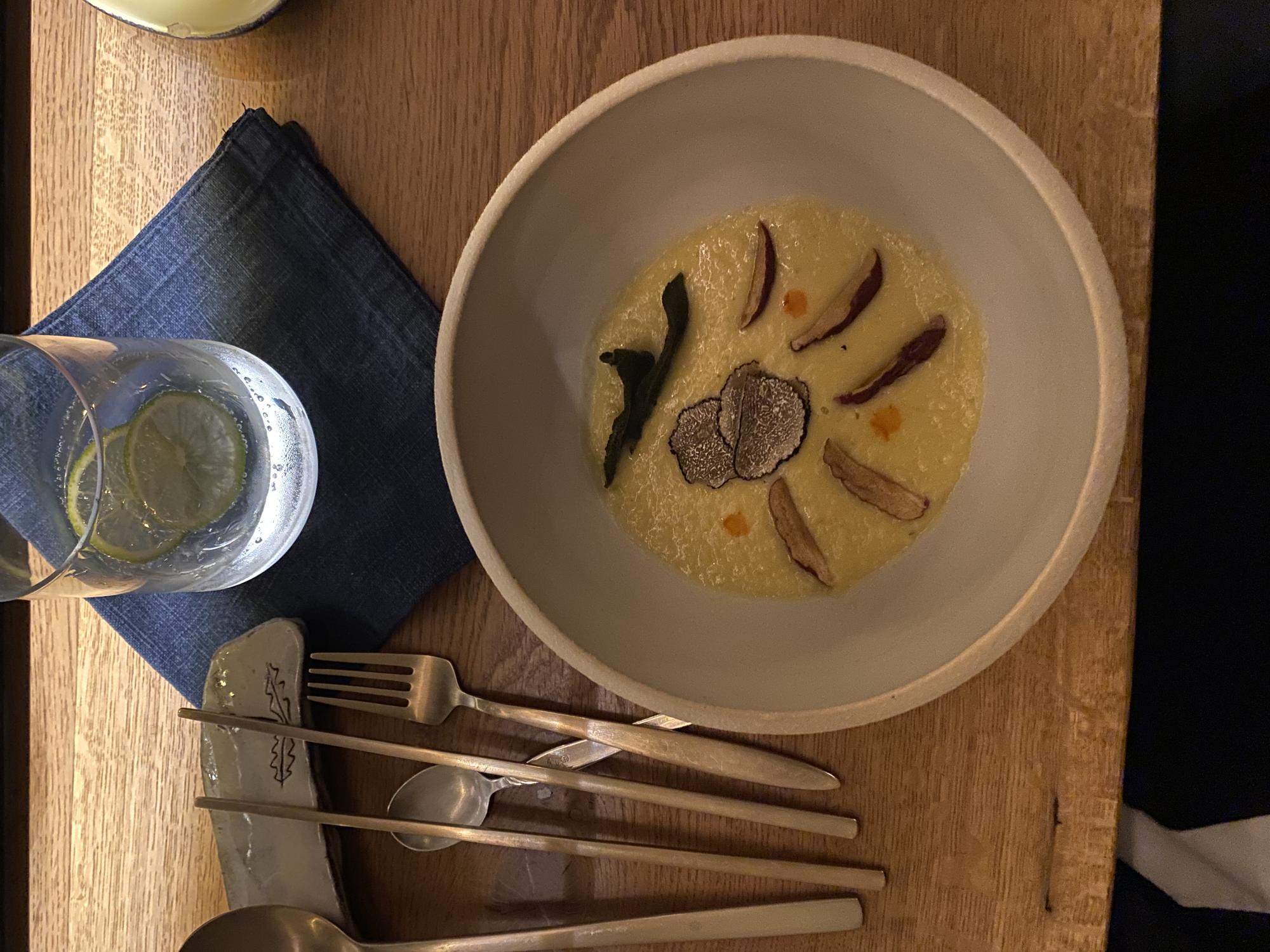 Close-up of plated seasonal dish on ceramic plate